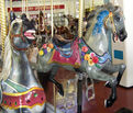 (L-R) Looff Jumper (Original To The Carousel), Eldridge Park Jumper (New Carving)